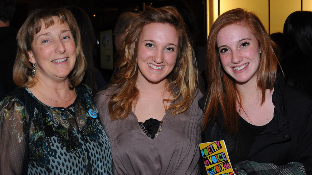 Poetry In Voice 2011 finalist Brogan Carruthers (centre) poses with supporters before the competition.