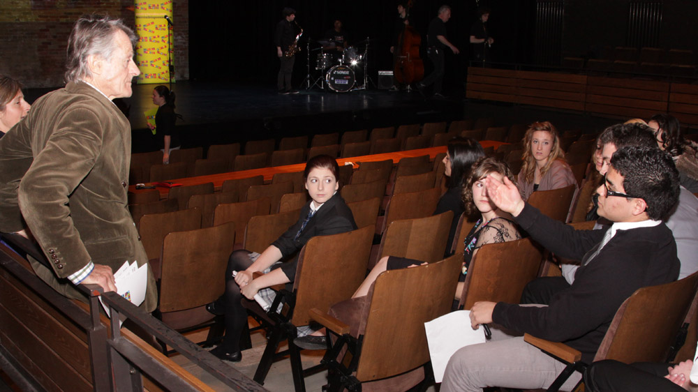 Tessa Griffin and Scott Griffin (far left) talk with Poetry In Voice 2011 finalists before the competition.